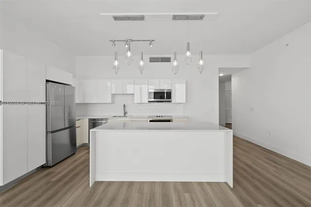 a view of a bathroom from a hallway