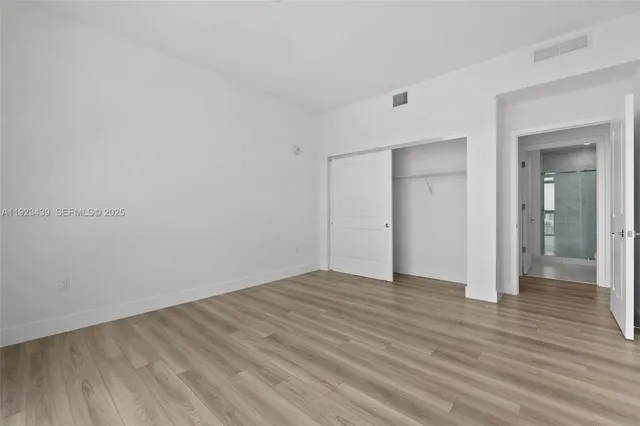 a kitchen with a table and chairs in it