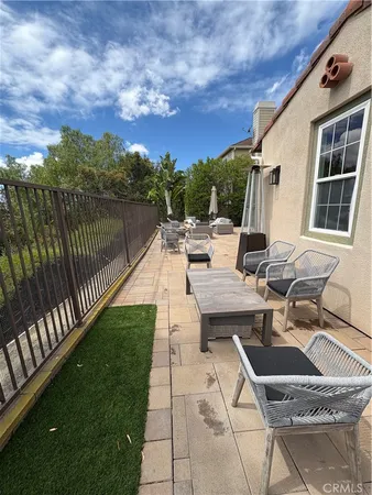 a view of a terrace with sitting area