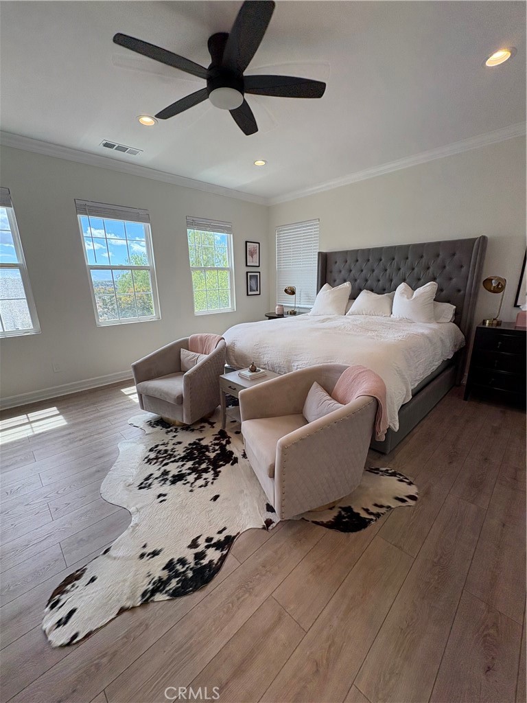 72 Downing Street Ladera Ranch, CA 92694 - Photo 10 of 24 a bedroom with a bed and wooden floor