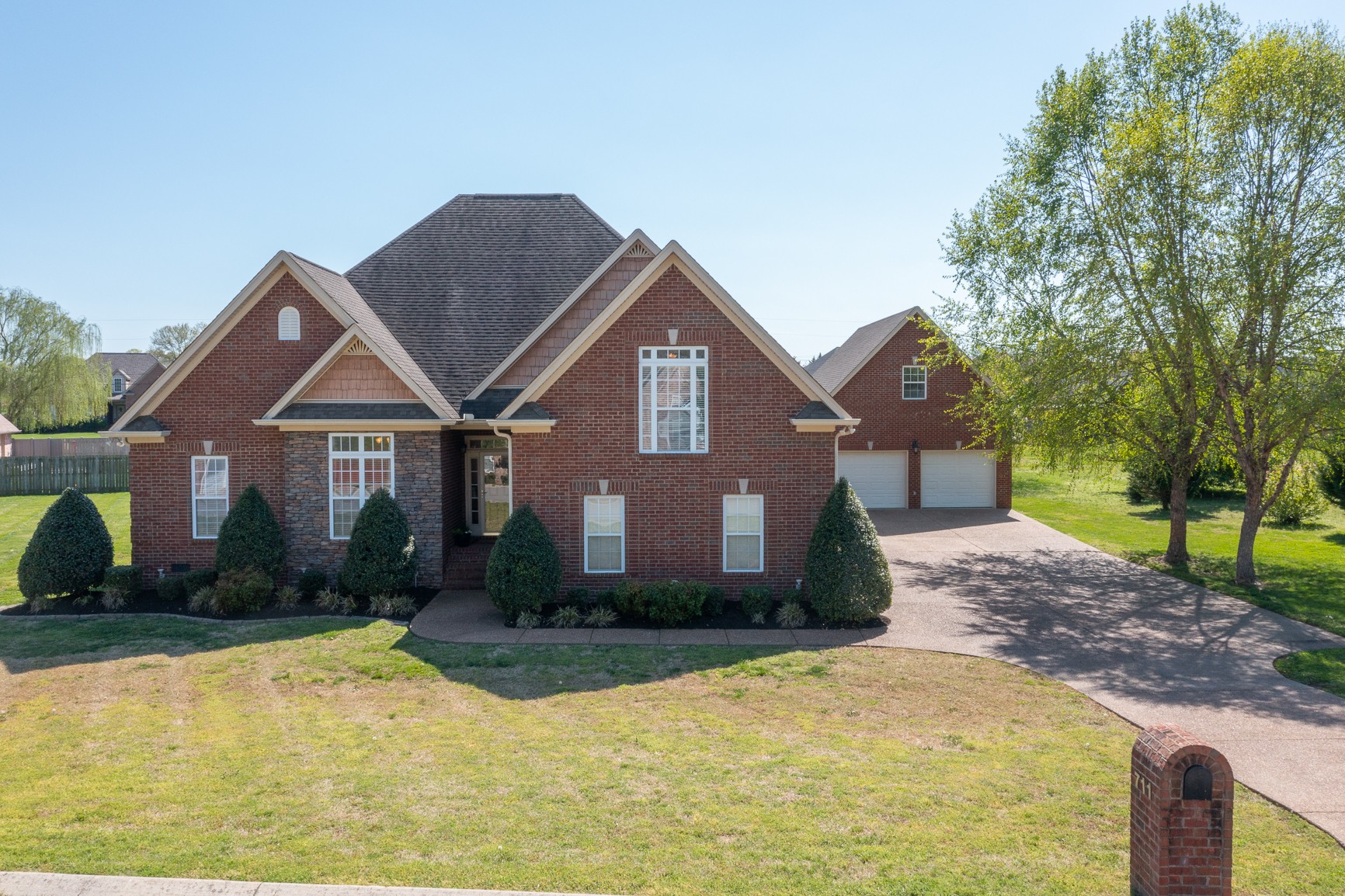 711 Heritage Road Lebanon, TN 37087 - Photo 1 of 49 a front view of a house with a yard