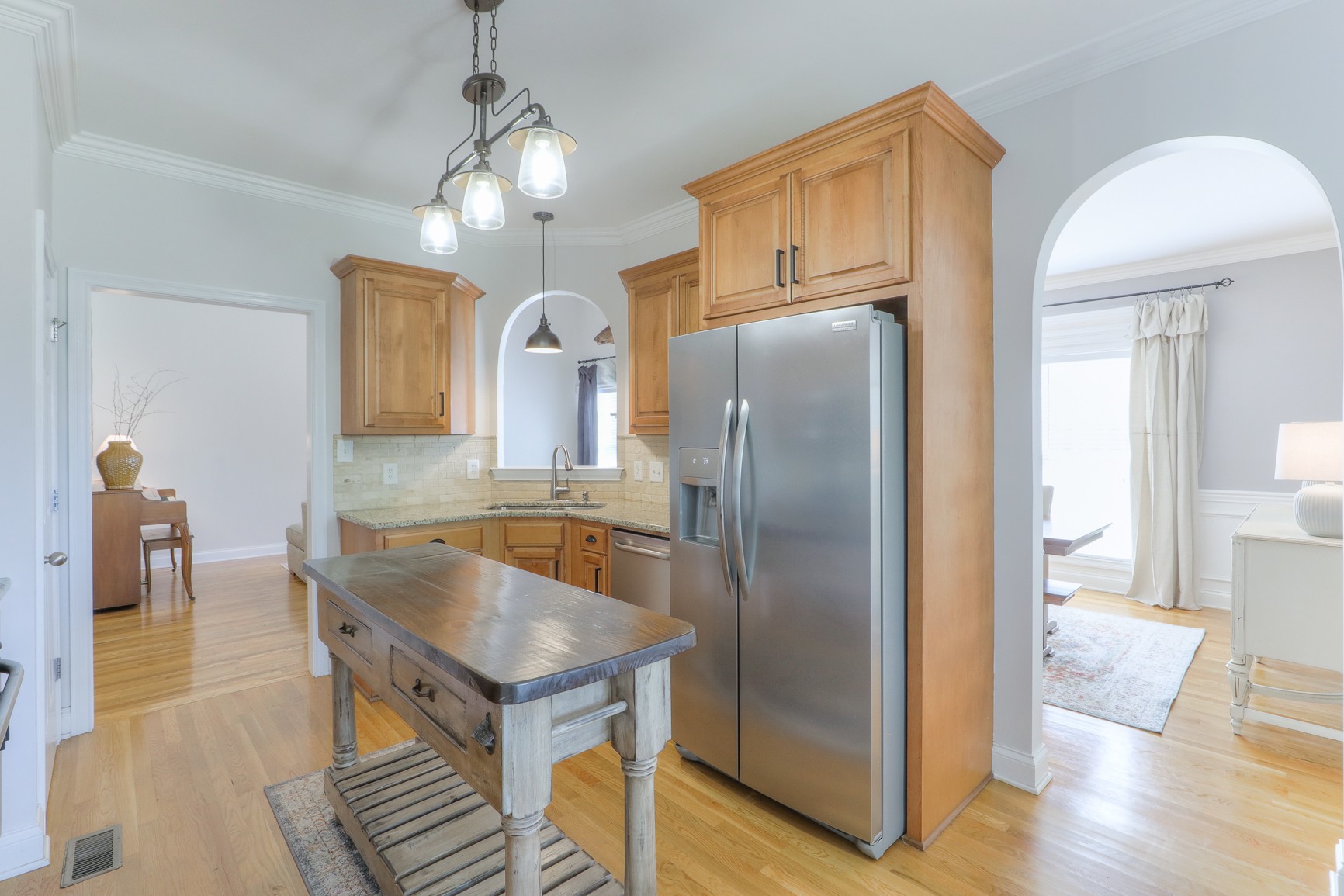 711 Heritage Road Lebanon, TN 37087 - Photo 16 of 49 a kitchen with stainless steel appliances granite countertop a refrigerator a sink and a stove