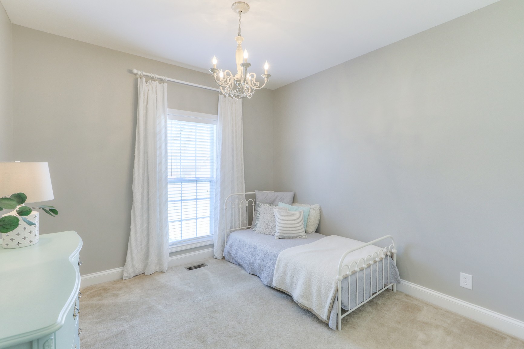 711 Heritage Road Lebanon, TN 37087 - Photo 22 of 49 a spacious bedroom with a bed and a chandelier