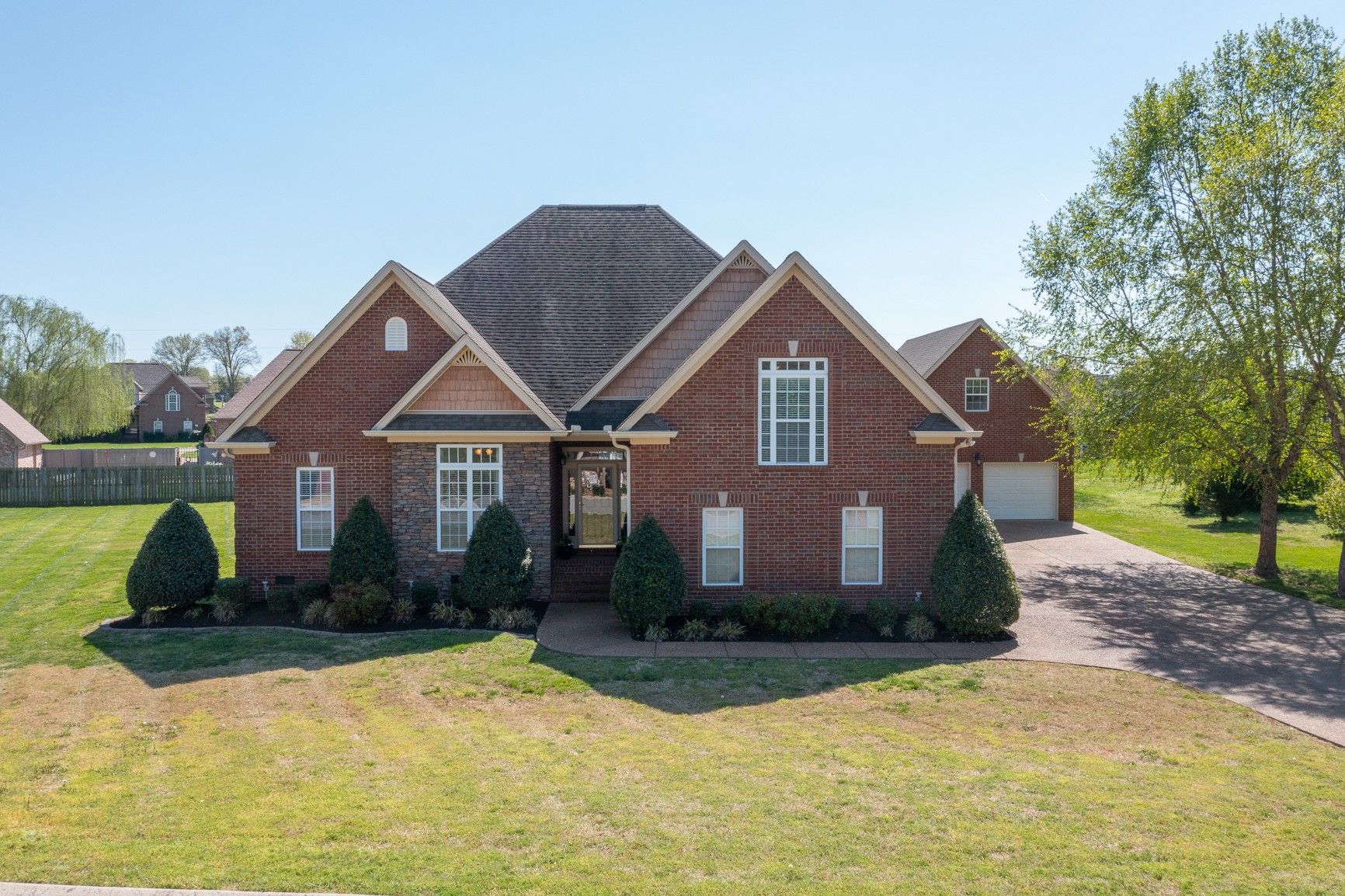 711 Heritage Road Lebanon, TN 37087 - Photo 4 of 49 a front view of a house with yard and green space