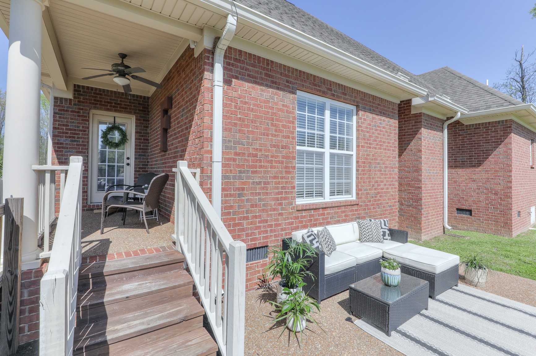 711 Heritage Road Lebanon, TN 37087 - Photo 32 of 49 a view of a patio with couches table and chairs and potted plants