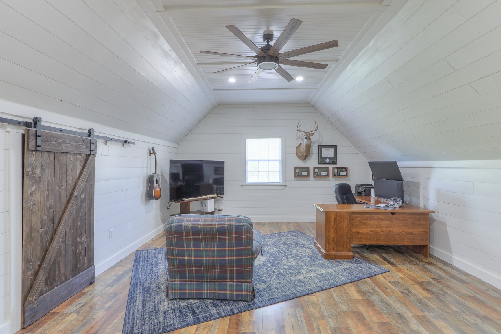 711 Heritage Road Lebanon, TN 37087 - Photo 35 of 49 a living room with furniture and a flat screen tv