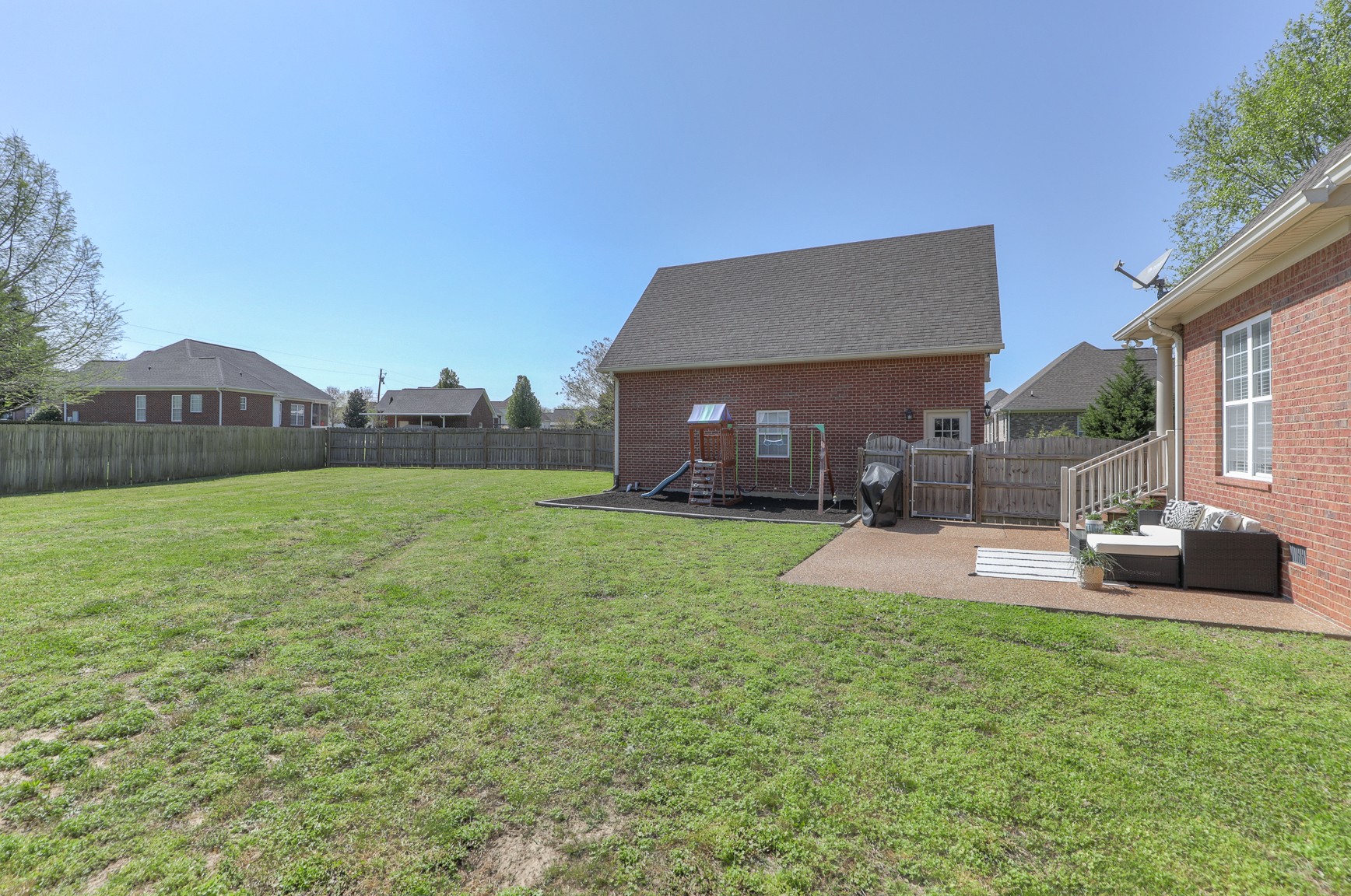 711 Heritage Road Lebanon, TN 37087 - Photo 39 of 49 a view of house with backyard and a garden