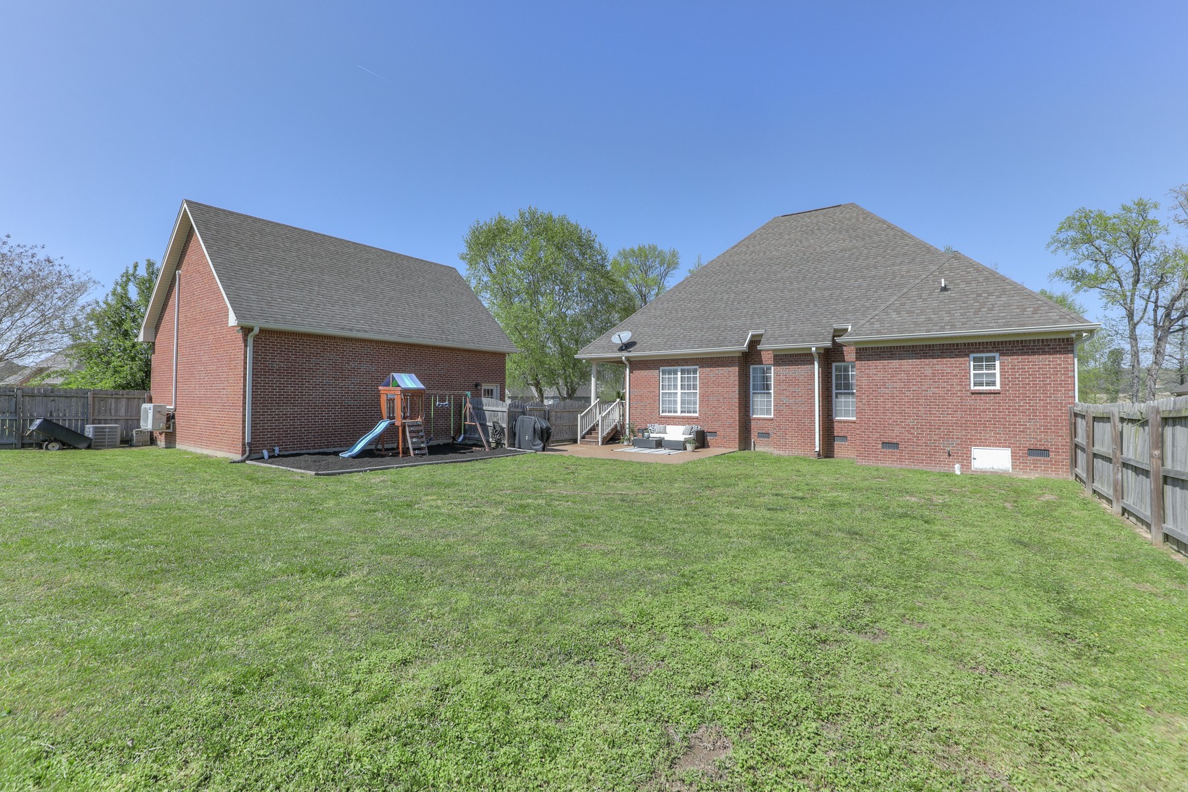 711 Heritage Road Lebanon, TN 37087 - Photo 40 of 49 a front view of a house with a garden