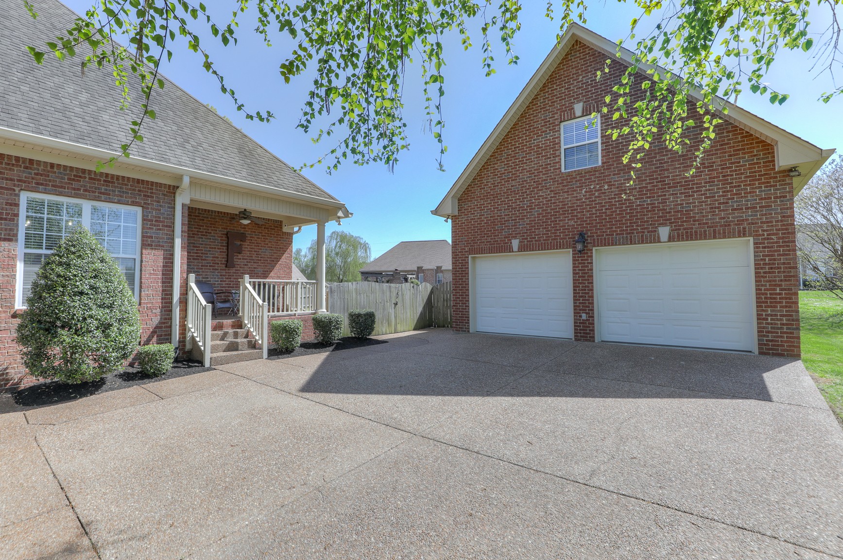 711 Heritage Road Lebanon, TN 37087 - Photo 5 of 49 a front view of a house with a yard and garage