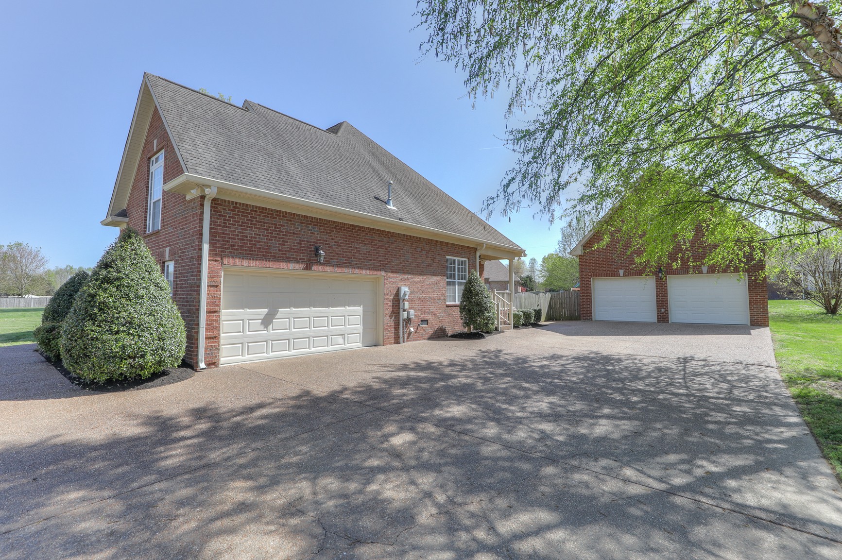 711 Heritage Road Lebanon, TN 37087 - Photo 41 of 49 a front view of a house with a yard and garage