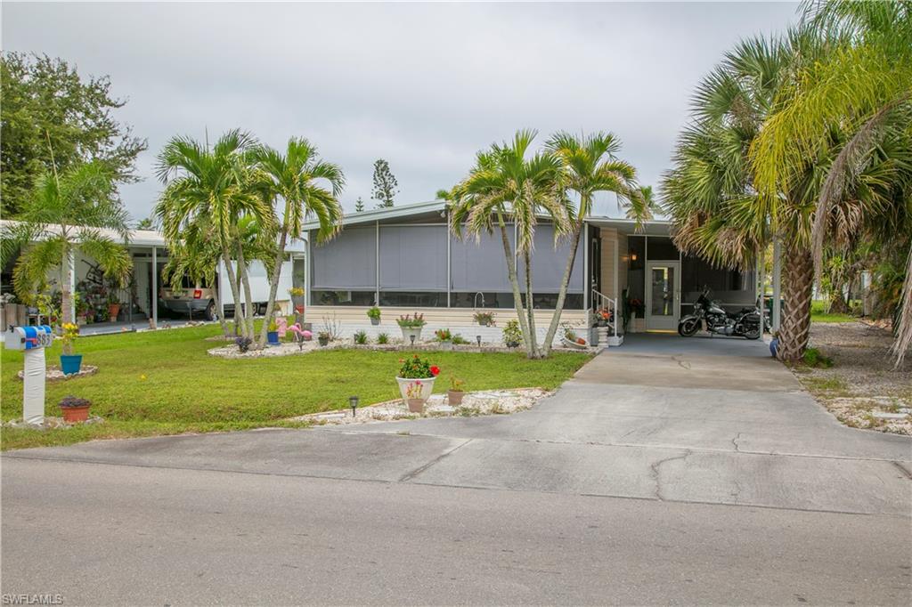 883 Manatee Road Naples, FL 34114 - Photo 4 of 15 a view of a yard with palm tree