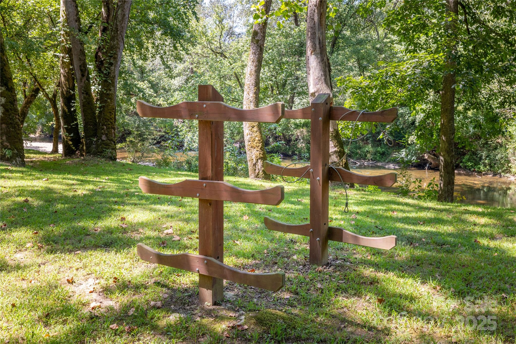 1038 Round Rock Road, Unit 49/50 Lenoir, NC 28645 - Photo 32 of 46 a view of a wooden deck with a yard