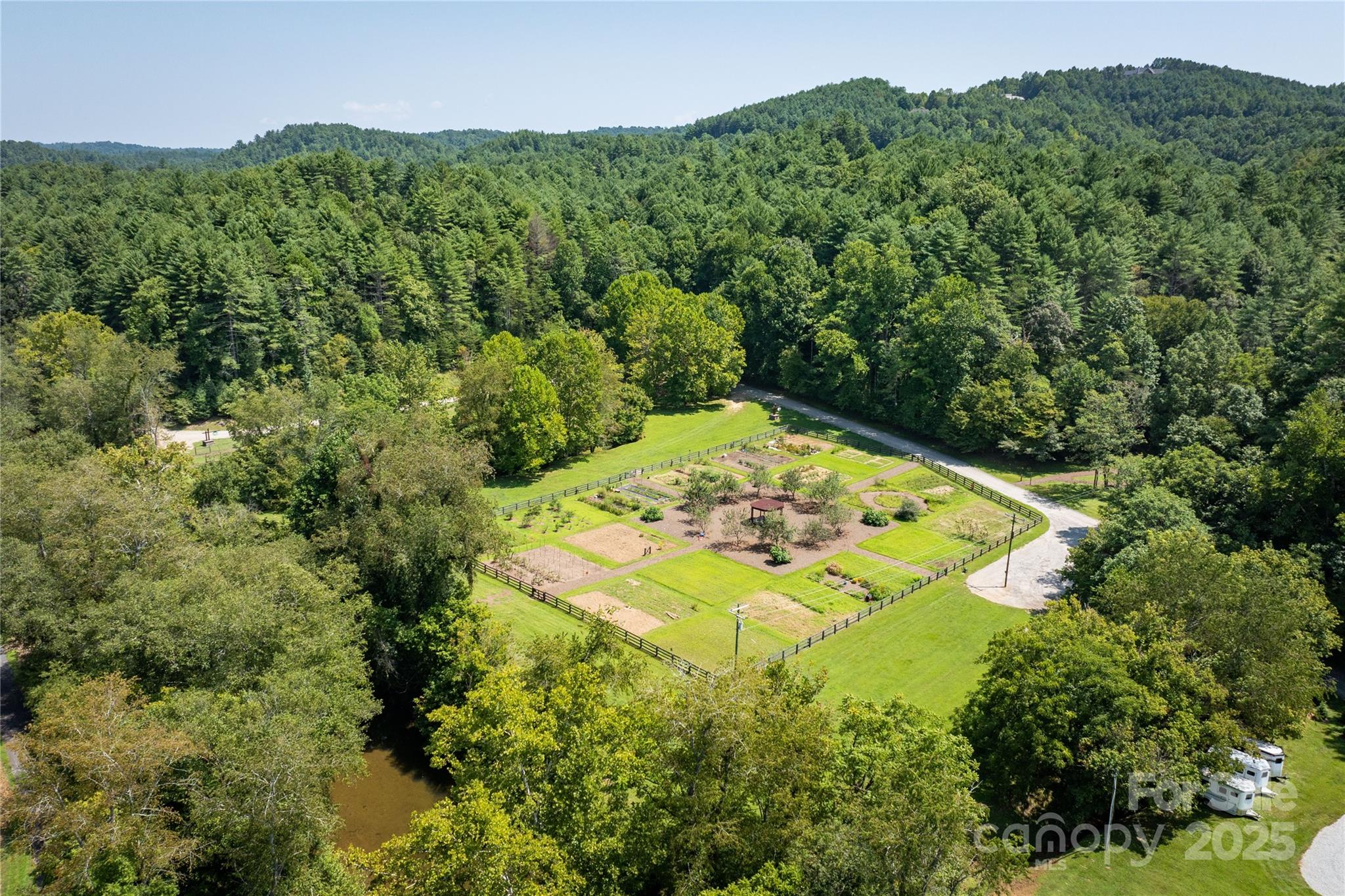 1038 Round Rock Road, Unit 49/50 Lenoir, NC 28645 - Photo 39 of 46 an aerial view of a house with a yard