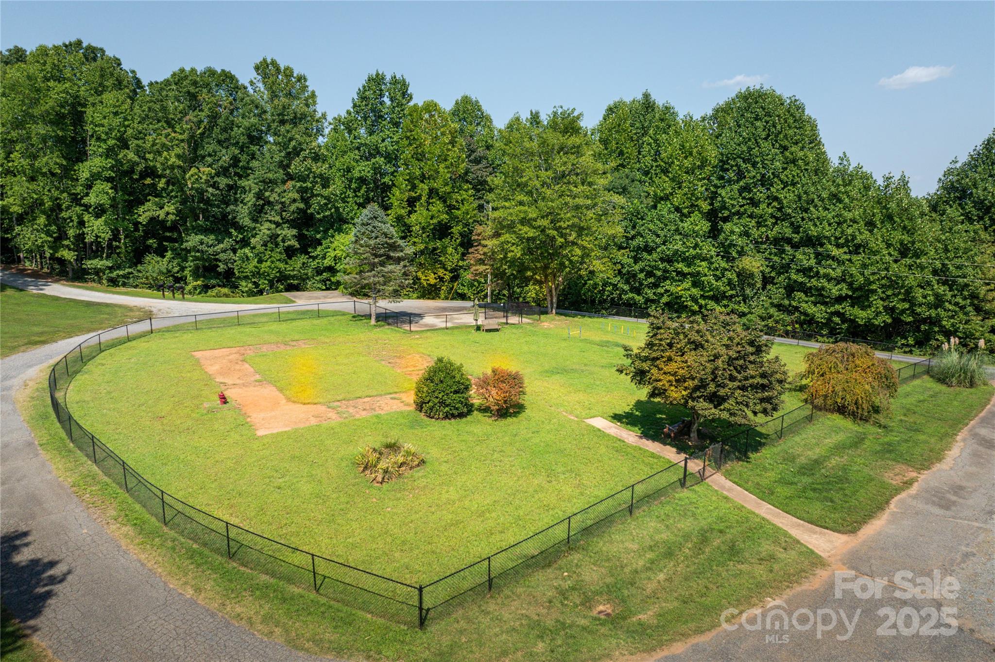 1038 Round Rock Road, Unit 49/50 Lenoir, NC 28645 - Photo 45 of 46 a view of a swimming pool with a yard and outdoor seating