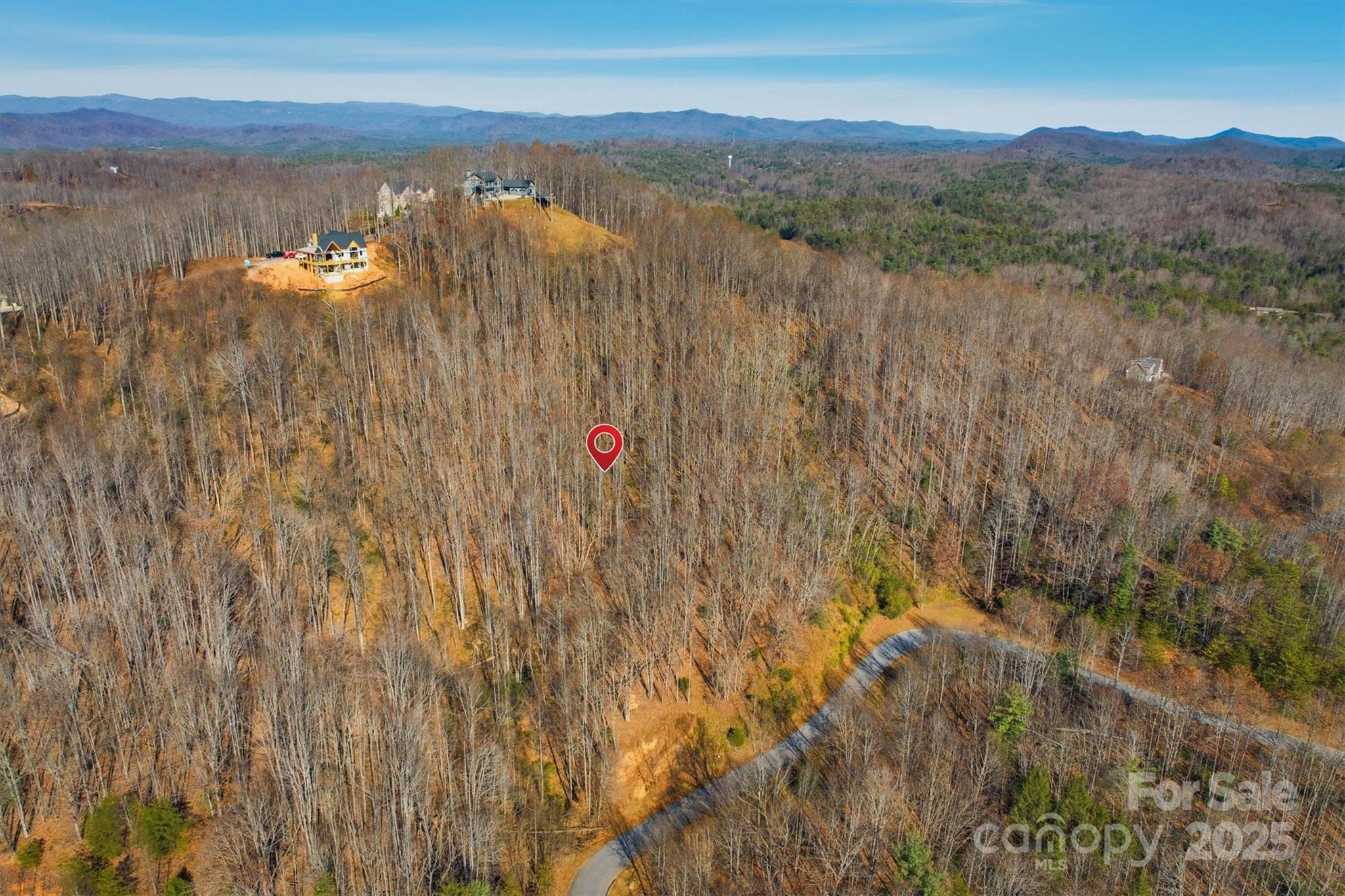 1038 Round Rock Road, Unit 49/50 Lenoir, NC 28645 - Photo 6 of 46 a view of a lake with a mountain in the background