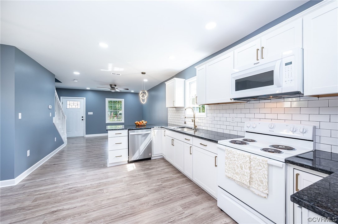706 Rome Street Petersburg, VA 23803 - Photo 11 of 26 a large kitchen with stainless steel appliances granite countertop a stove and a sink