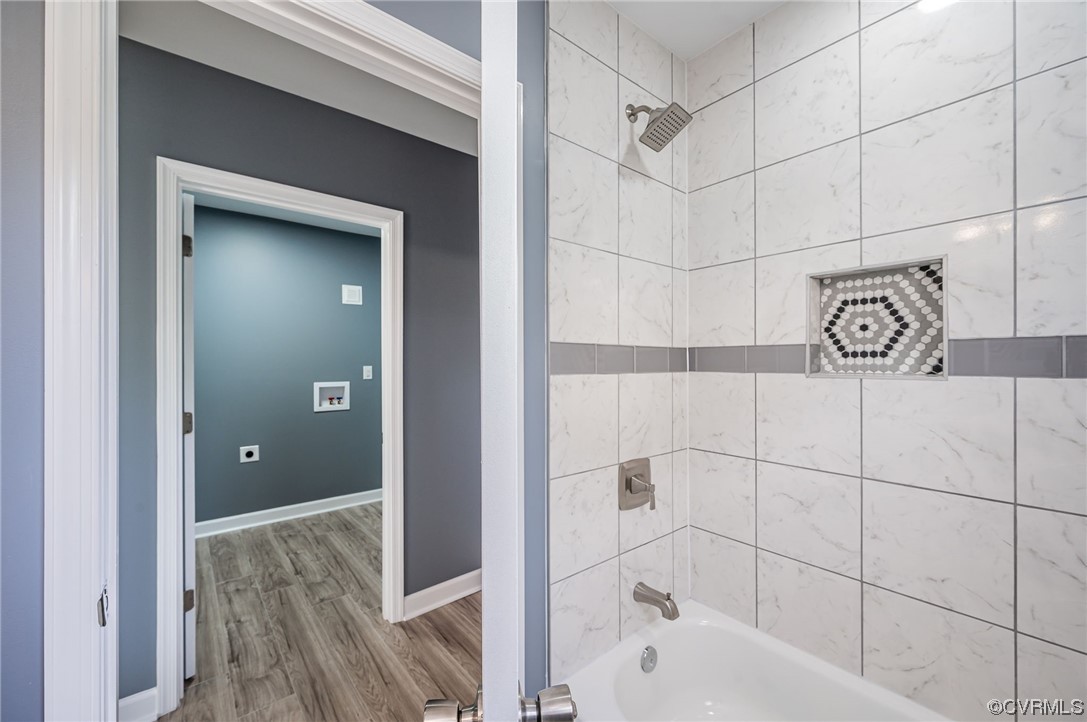 706 Rome Street Petersburg, VA 23803 - Photo 13 of 26 a bathroom with a bathtub and shower