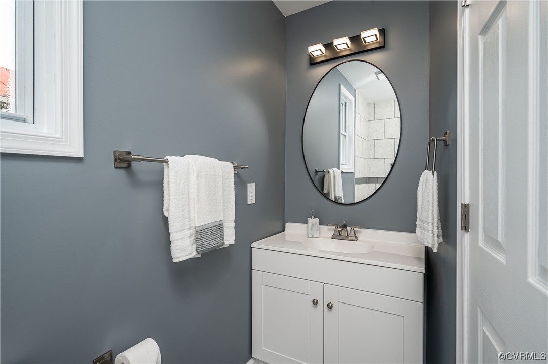 706 Rome Street Petersburg, VA 23803 - Photo 16 of 26 a bathroom with a sink and a mirror