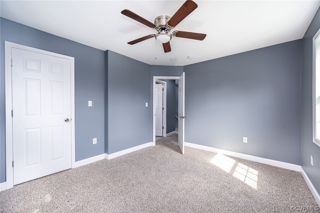 706 Rome Street Petersburg, VA 23803 - Photo 18 of 26 a view of an empty room and a ceiling fan