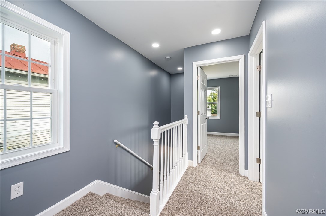 706 Rome Street Petersburg, VA 23803 - Photo 19 of 26 a view of a hallway with wooden floor and windows