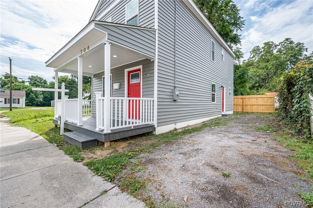 706 Rome Street Petersburg, VA 23803 - Photo 25 of 26 a backyard of a house with a garden and deck