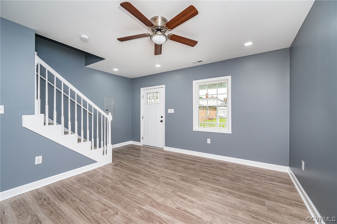 706 Rome Street Petersburg, VA 23803 - Photo 6 of 26 a view of an empty room with window and wooden floor