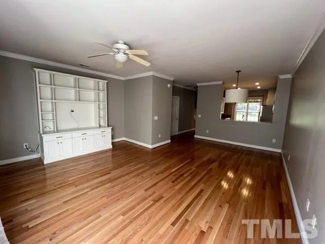 wooden floor in an empty room with window