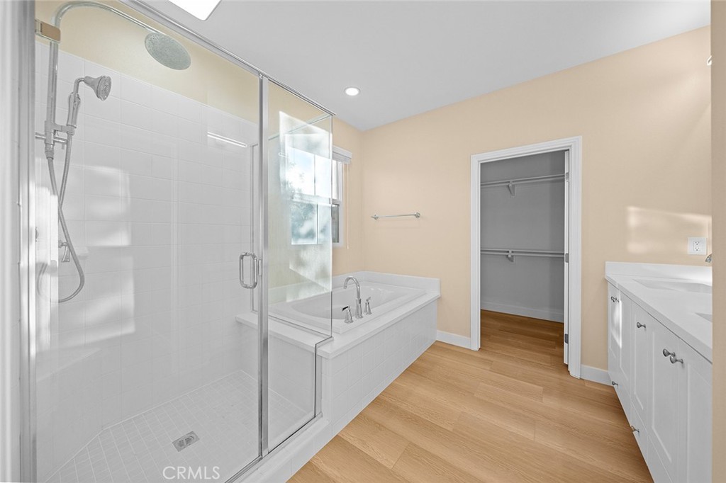 143 Rodeo Irvine, CA 92602 - Photo 21 of 37 a spacious bathroom with a tub shower and sink