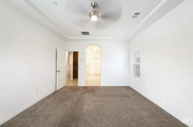 an empty room with a empty space and windows