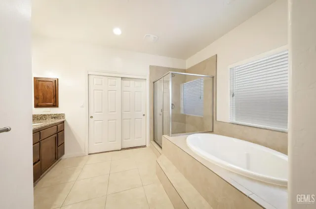 a bathroom with a bathtub and a sink