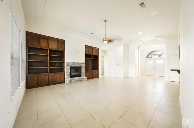 a view of an empty room with a fireplace