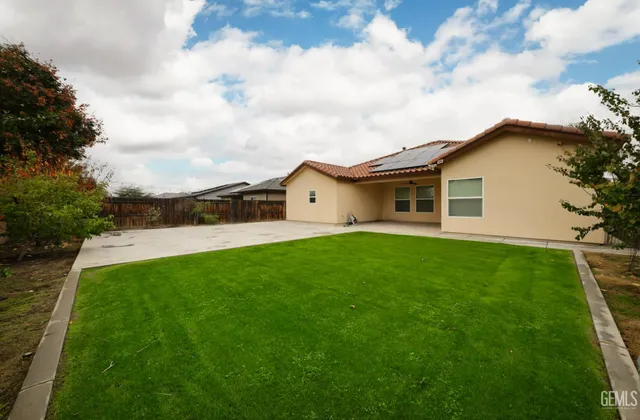 an aerial view of a house with a garden and plants