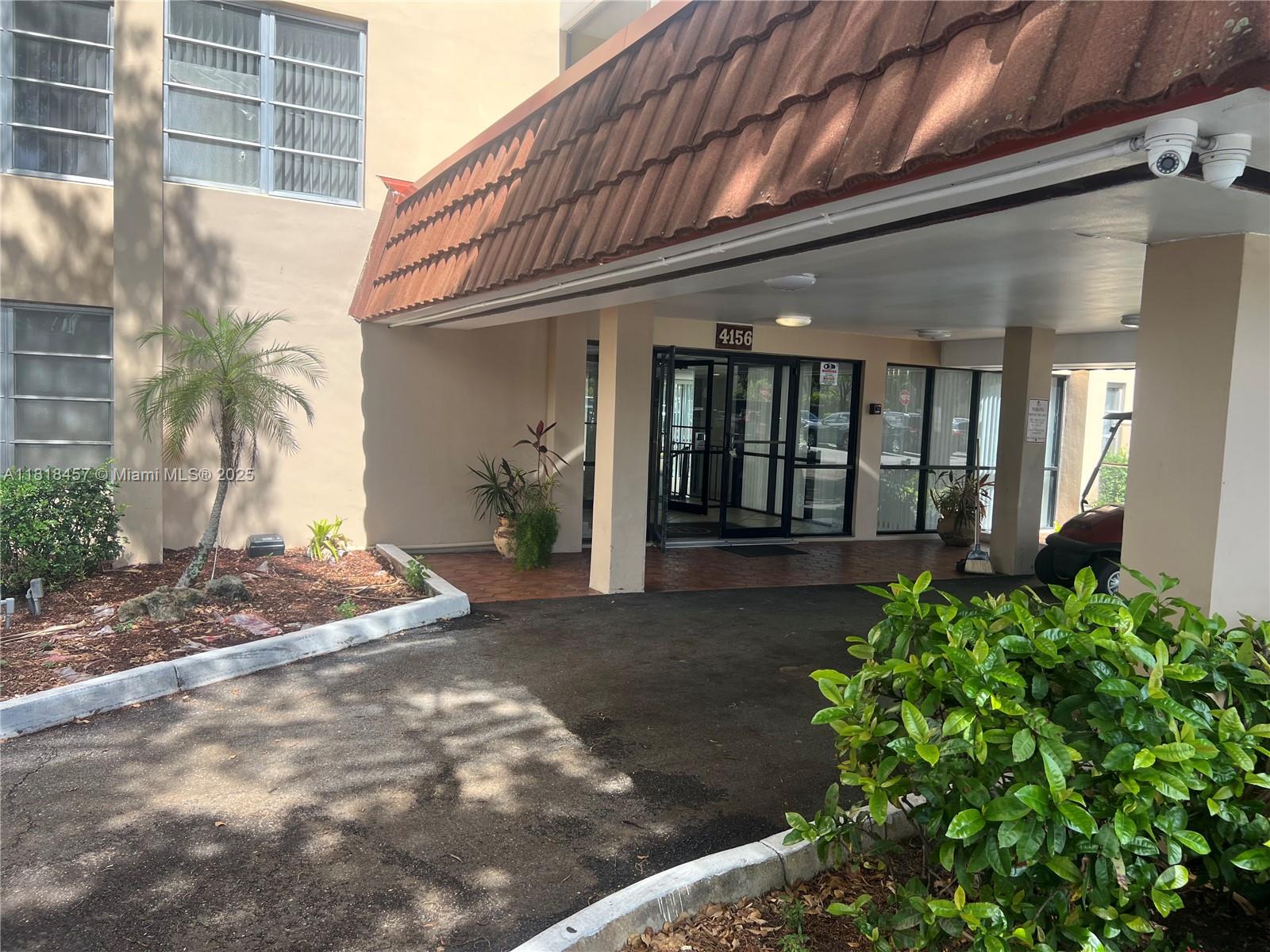 4156 Inverrary Drive, Unit 309 Lauderhill, FL 33319 - Photo 3 of 16 a view of a house with potted plants