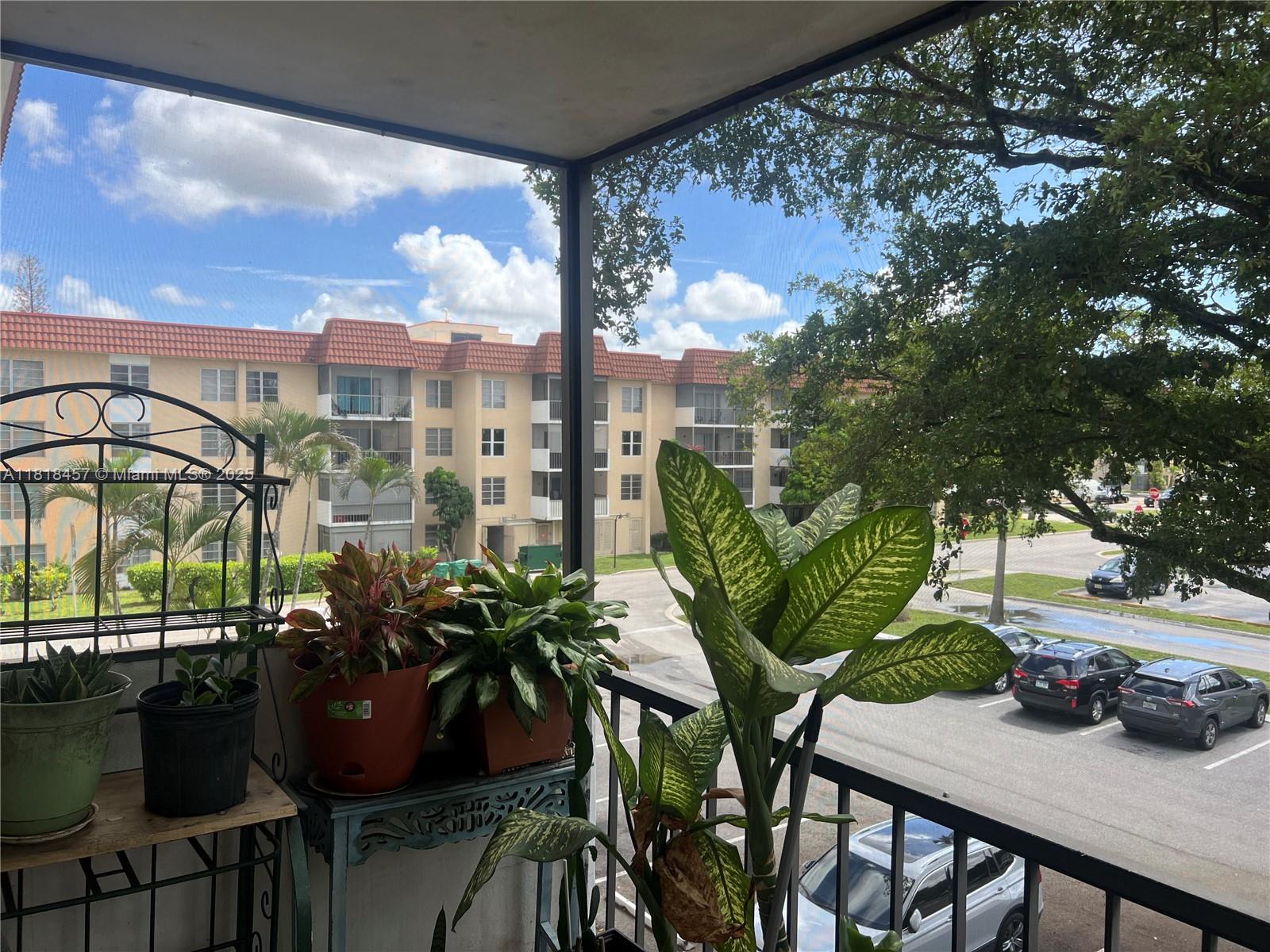 4156 Inverrary Drive, Unit 309 Lauderhill, FL 33319 - Photo 10 of 16 a view of balcony with a potted plant and outdoor seating
