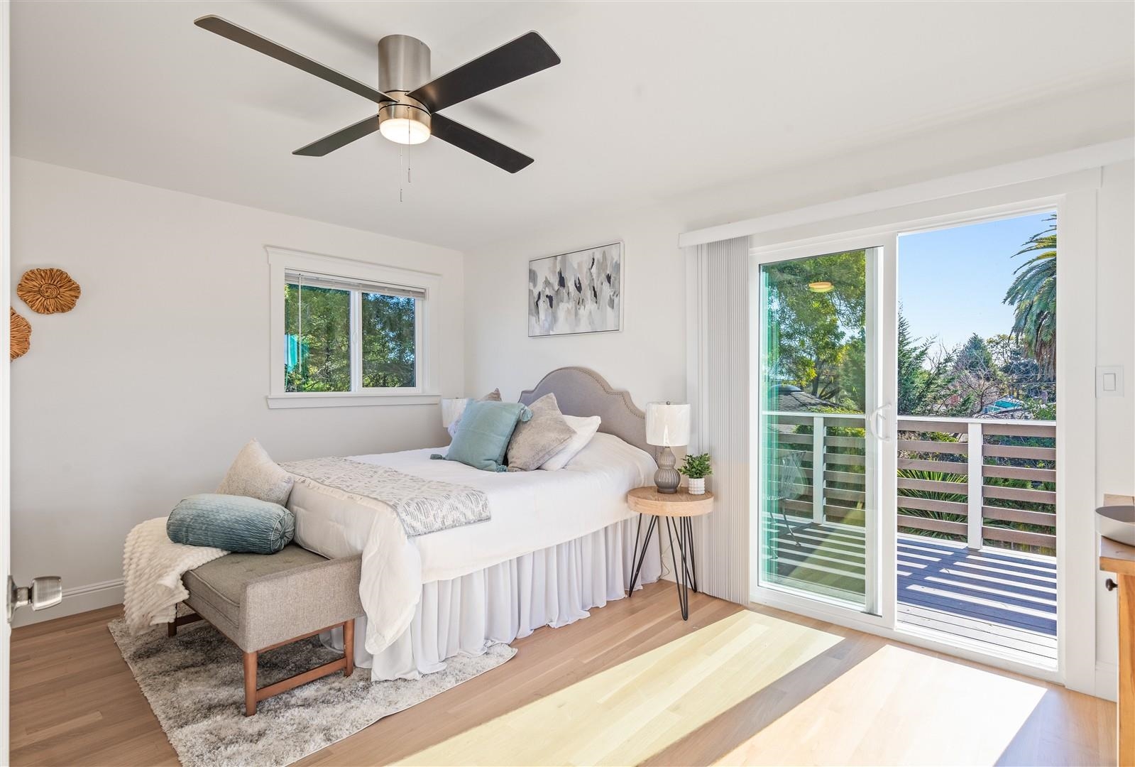 1524 Blake Street Berkeley, CA 94703 - Photo 15 of 59 Bedroom featuring access to exterior, light wood finished floors, and a ceiling fan