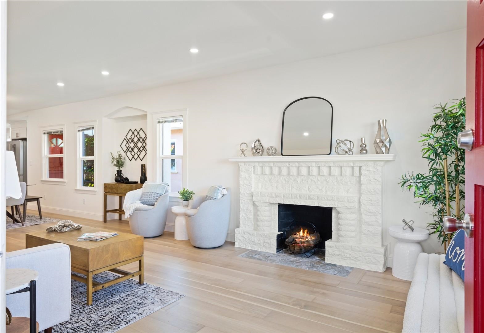 1524 Blake Street Berkeley, CA 94703 - Photo 42 of 59 Living room with wood finished floors, recessed lighting, and a brick fireplace