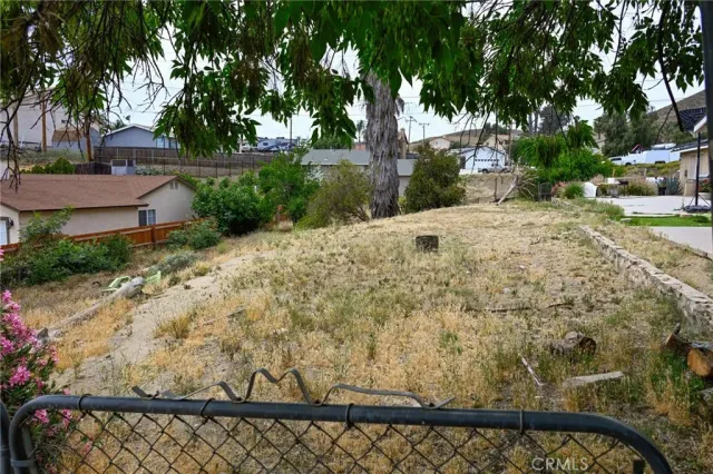 a view of a backyard of the house