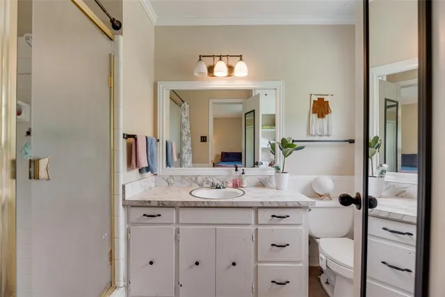 a bathroom with a sink vanity and a mirror