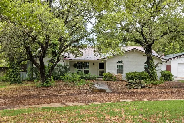 a backyard of a house with seating space
