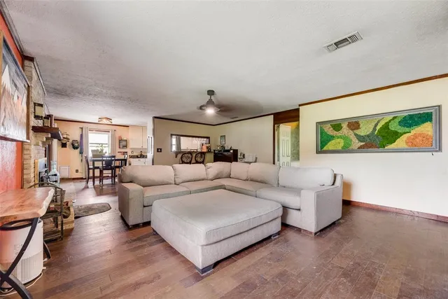 a living room with couches and a large window