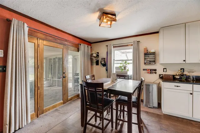 a view of a dining room with furniture and window
