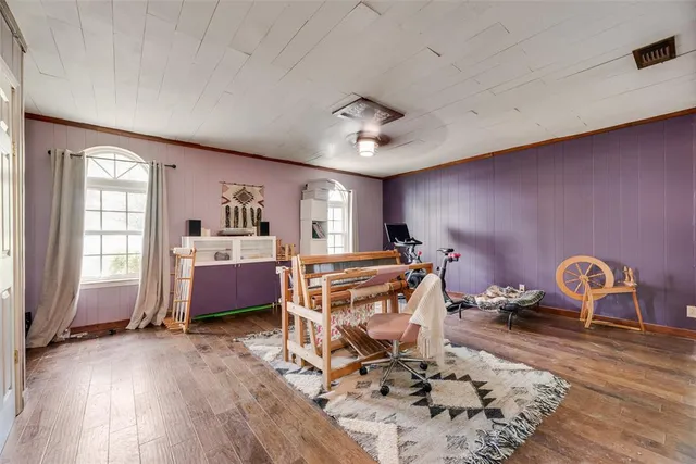 a room with furniture a rug and a window