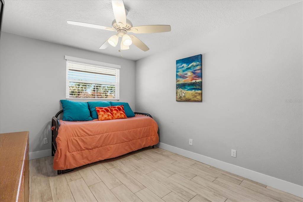 159 Holland Road Ormond Beach, FL 32176 - Photo 18 of 55 a living room with a bed furniture and a window