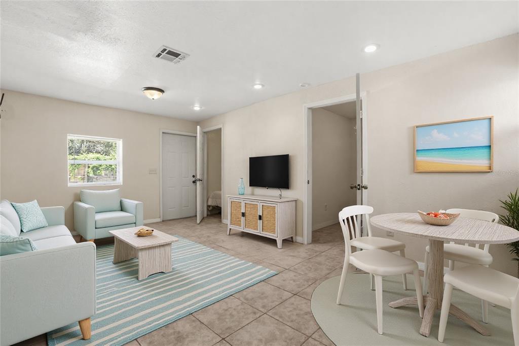 159 Holland Road Ormond Beach, FL 32176 - Photo 33 of 55 a living room with furniture and a flat screen tv