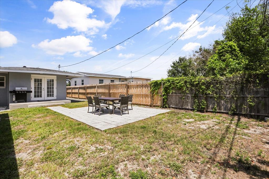 159 Holland Road Ormond Beach, FL 32176 - Photo 42 of 55 a view of a house with backyard porch and sitting area