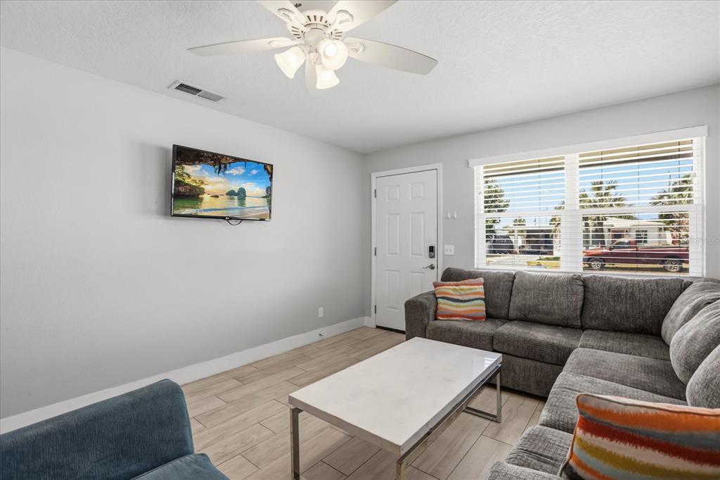 159 Holland Road Ormond Beach, FL 32176 - Photo 5 of 55 a living room with furniture and a large window