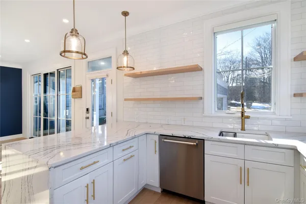 a kitchen with center island and windows