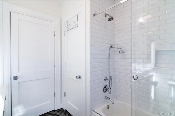 a bathroom with a bathtub and a shower