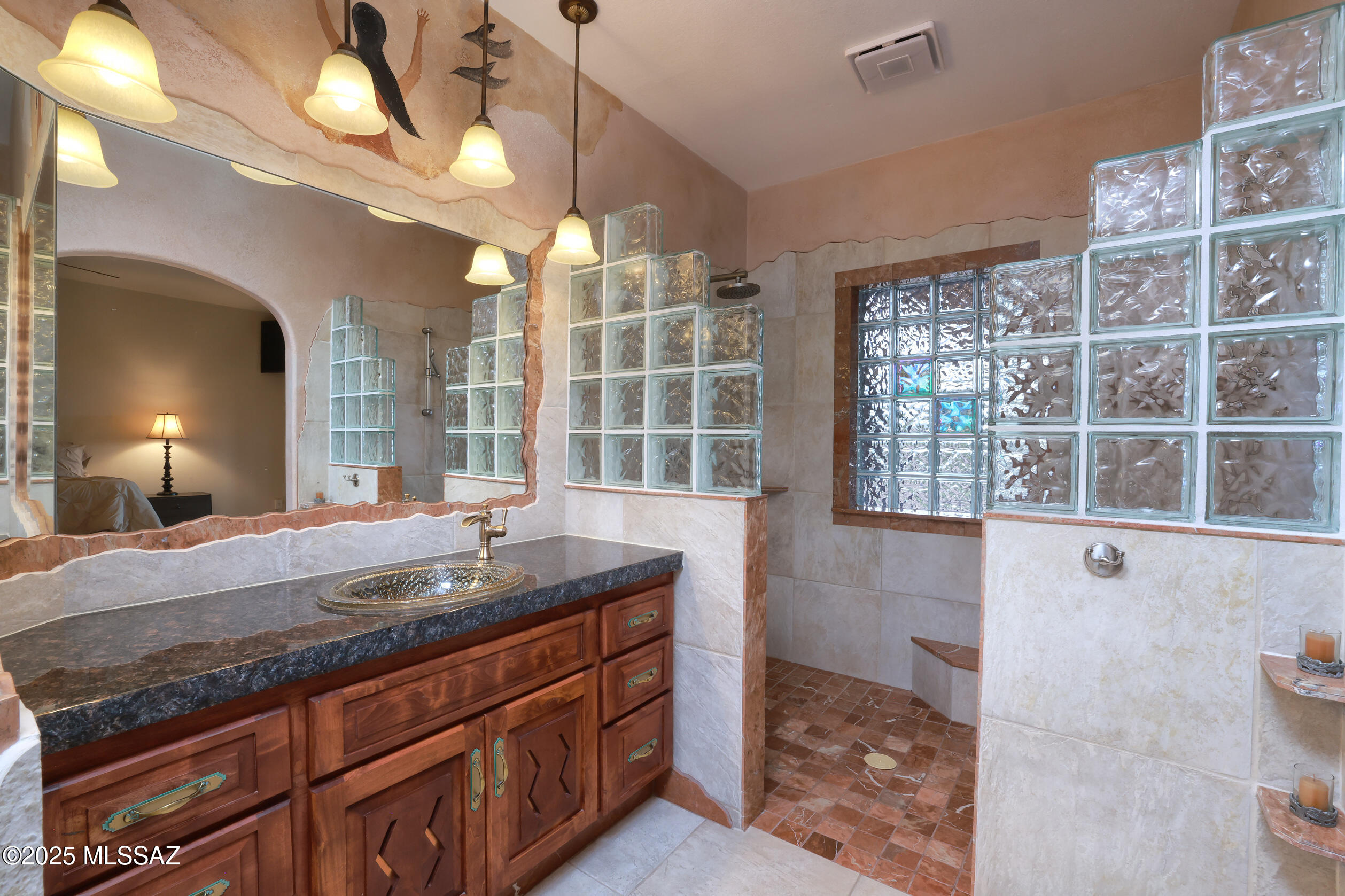 925 North Rancho Del Jefe Loop Tucson, AZ 85748 - Photo 24 of 52 a bathroom with a granite countertop sink and a mirror