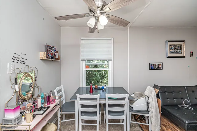 a view of a dining room with furniture wooden floor and chandelier